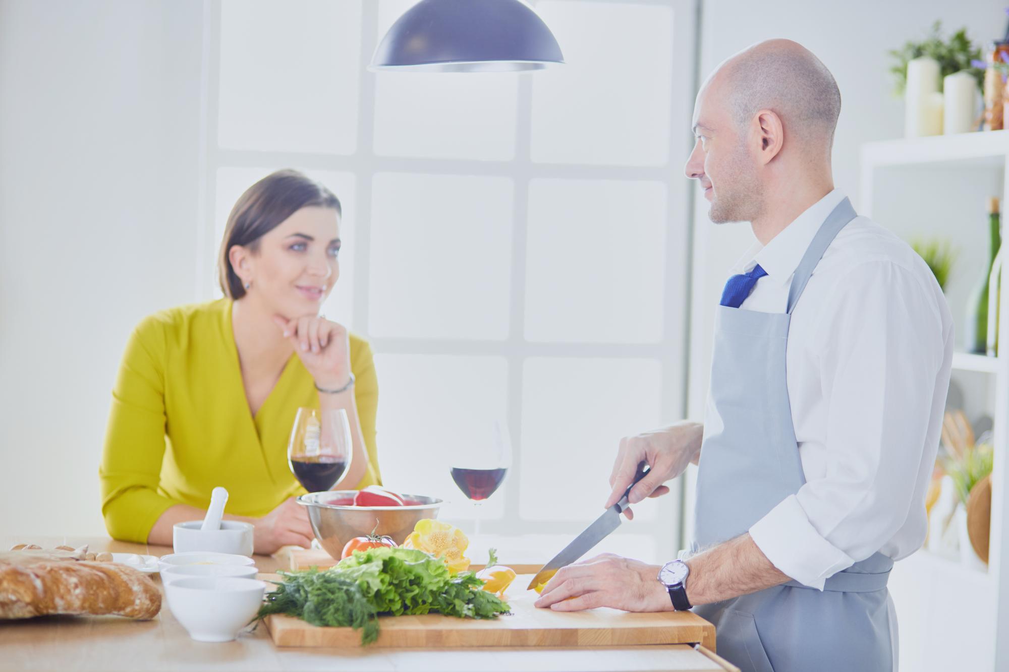 Chef speaking with client over plated tasting